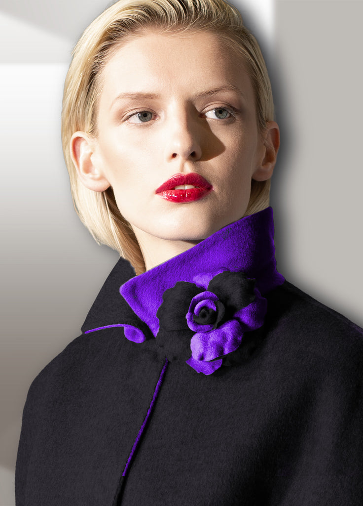 Black /violet reversible double face cashmere coat with detachable flower pin on model close up