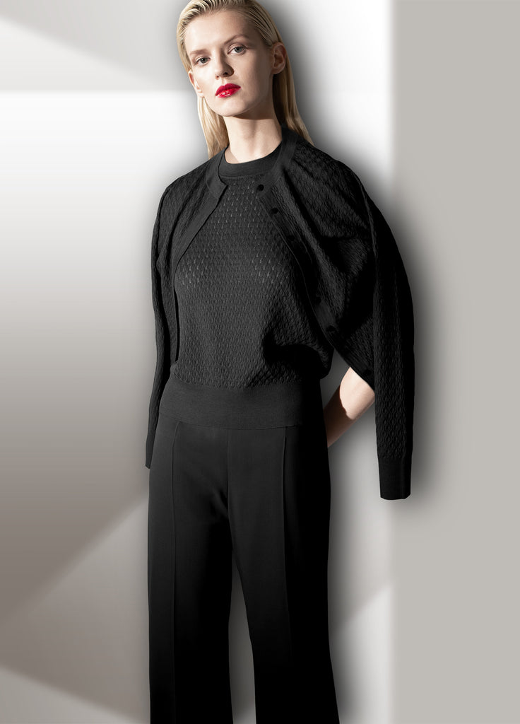 Cashmere sweater set with vine lace stitch - crew cardigan over model shoulders with crew neck tee and coordinating fine wool crepe wide leg pants black
