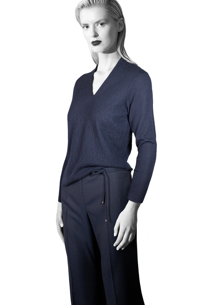ultra fine cashmere textured navy v-neck with wide leg pant on model