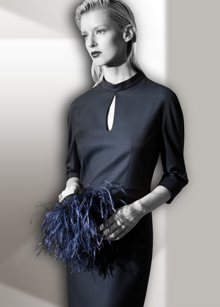 Women's navy dress with detachable feather cuffs shown with cuffs removed