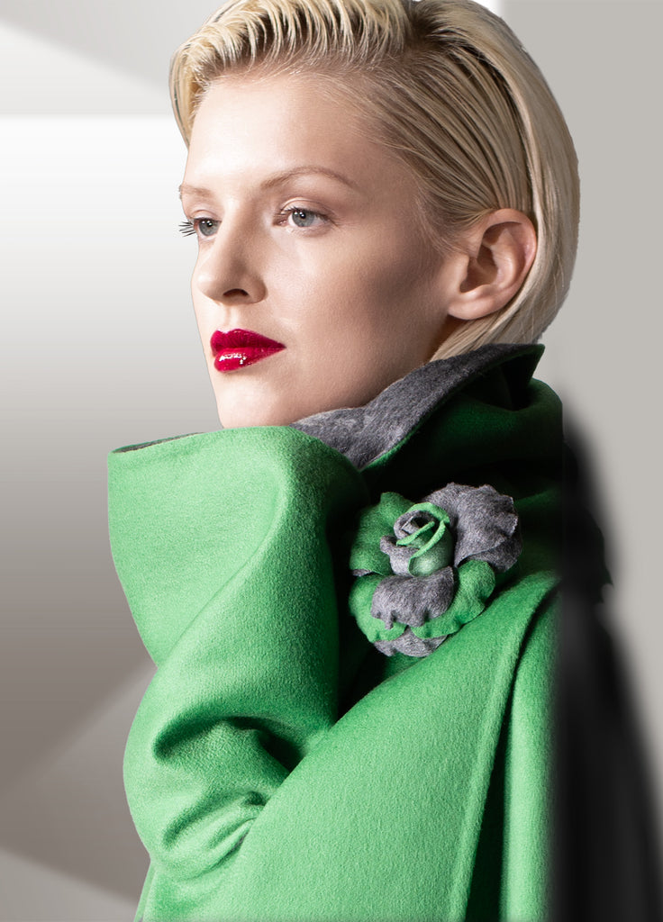 Cashmere double face coat with scarf and flower pin in electric green with opal grey on model close up