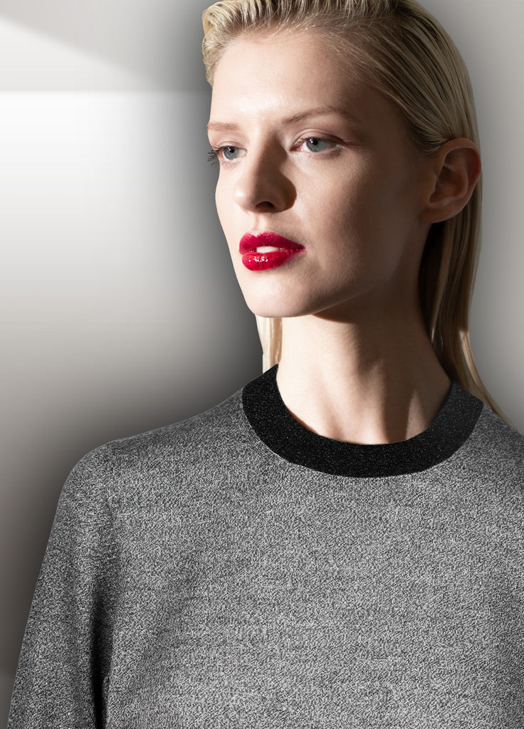 cashmere second skin crew neck in black white with black lame trim close up on model