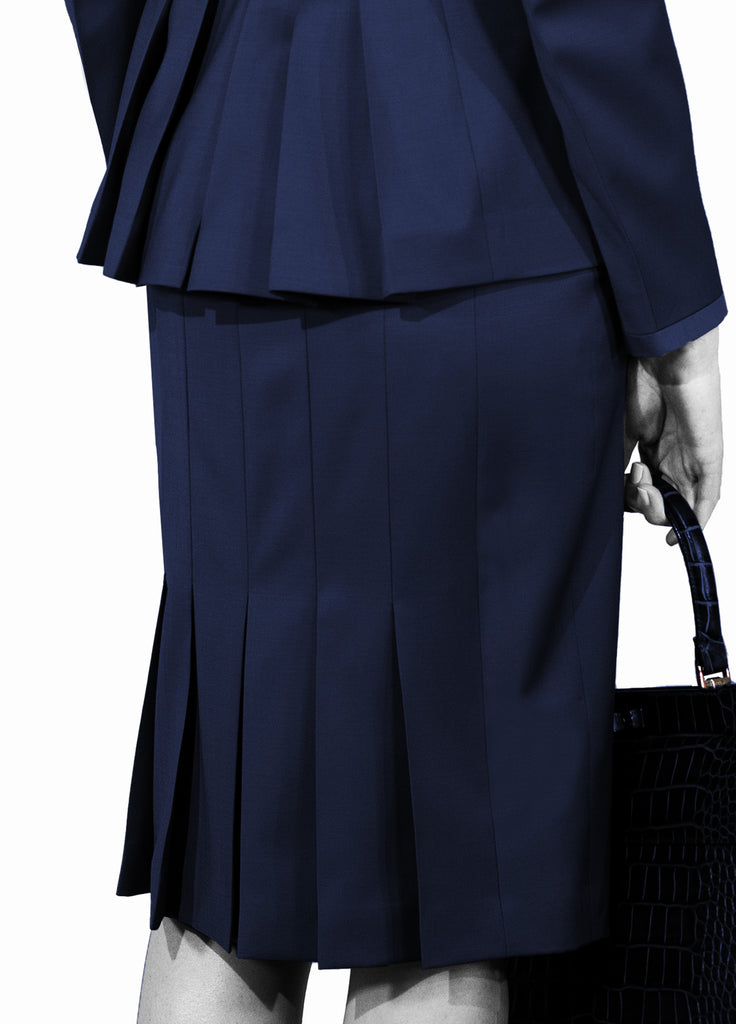 Women's single button wool shawl collar jacket with belt indigo blue back view of pleats with skirt