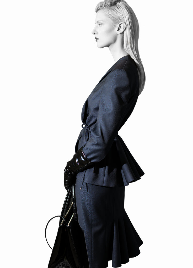 Women's navy skirt suit with back fluid detail